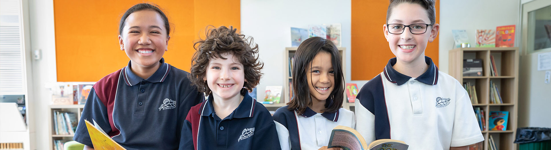 smiling students in a school library